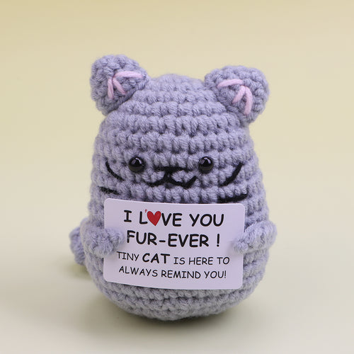 Handmade crochet cat holding a love card